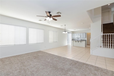 Unfurnished living room featuring visible vents, s