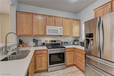 Kitchen with appliances with stainless steel finis