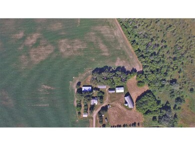 Ariel view of farm with multiple buildings.