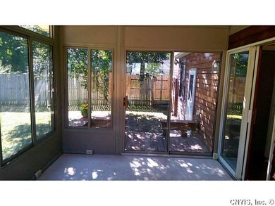 Backyard. BBQ area and rear door of garage