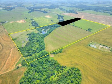 Wooded creek traverses east 1/3 of property with a