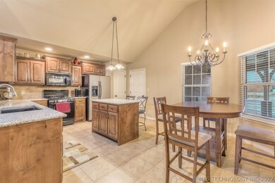 Kitchen with dining area, pendant/chandelier light