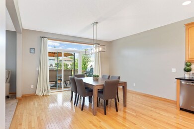 Spacious dining room located between the kitchen and living room.