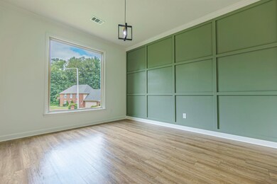 Empty room with light hardwood / wood-style floori