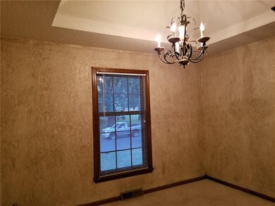 Formal dining room with vaulted ceiling
