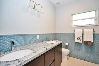 Bathroom 1 with shower/tub combo on the right (not