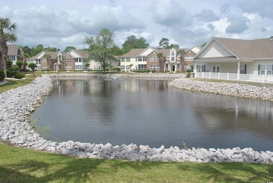 Property view of water with a residential view