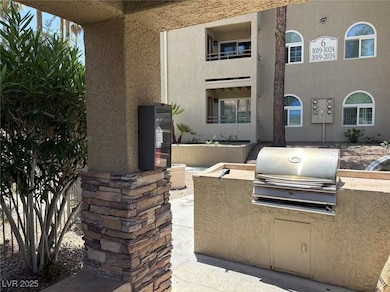 View of patio featuring exterior kitchen