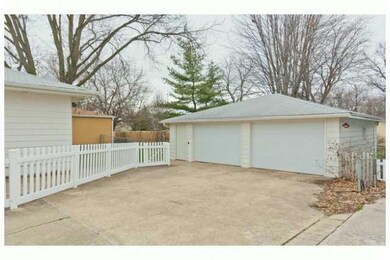 Den/Family/Great Room. Family room features built-in cabinets on both sides of the window seat, which has storage underneath.  Fireplace is gas log.  Door on left opens to master bedroom with 3/4 bath.