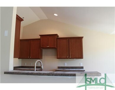 Kitchen. Vaulted ceilings make kitchen look larger