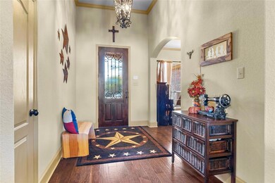 Wood floors greet in the spacious foyer!