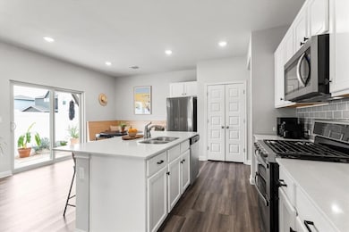 Kitchen featuring stainless steel appliances, dar