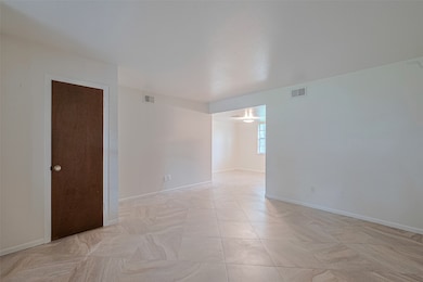 The living room and coat closet