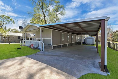 Front of home. Long driveway for ample parking and