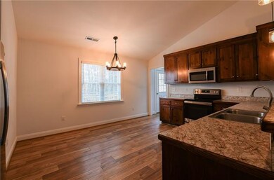 Large eat in Kitchen with stainless steel appliances