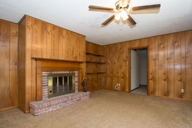 Wood burning fireplace surrounded by beautifully s