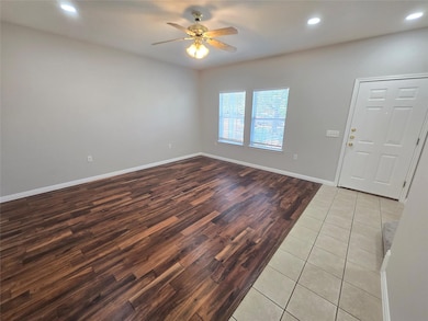 Entryway featuring recessed lighting, light tile patterned floors, and ceiling fan