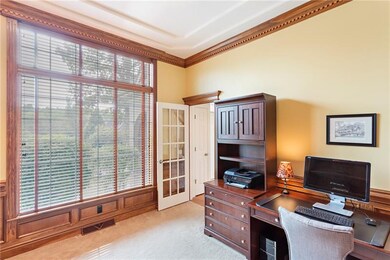 Den features 10' ceilings & judge's paneling.