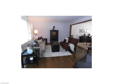 Living Room with hardwood floors and opens to dini