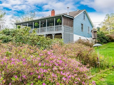 Covered Deck With Views Of Stunning Landscaping
