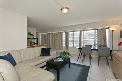 Living, dining and partial kitchen view as you ent