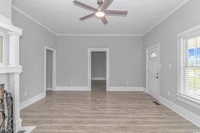 Unfurnished living room featuring light hardwood /