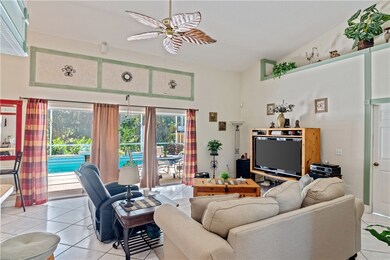 Family Room with Triple Sliders to Pool Area, Plan