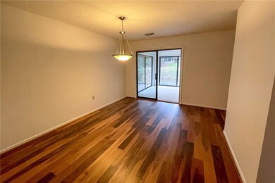 Dining Room with view of sunroom and back yard