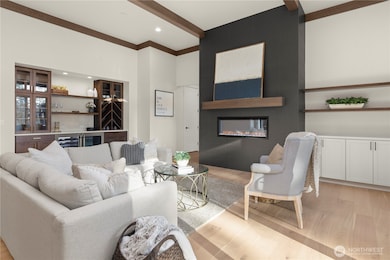 Relax in luxury in this Spacious Beam appointed Great room with a Wine Bar wall for entertaining.