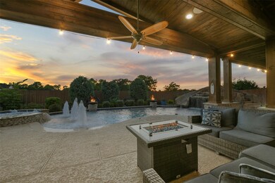 Extended cool decking, wired for sound, recessed lighting, ceiling fans, stained cedar and stone posts, and then there's the pool - wow! A true dream backyard!