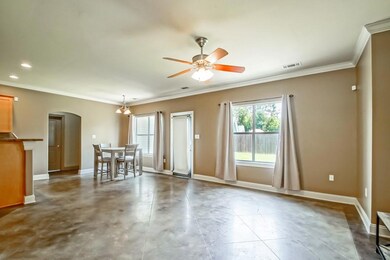 Open floor plan with view of backyard.
