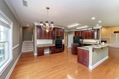 Friendly kitchen includes built in desk and breakf