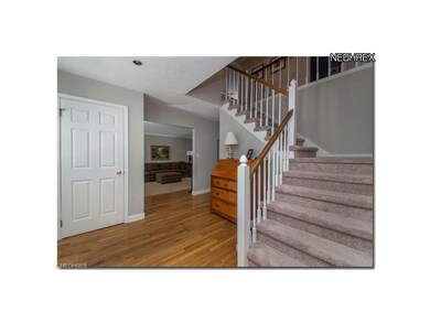 WELCOMING FOYER WITH HARDWOOD FLOORS AND CLASSIC S