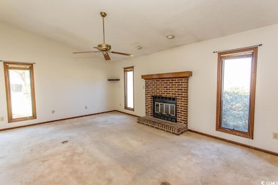 Unfurnished living room featuring a wealth of natu