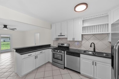 Kitchen cabinets have been painted, replacement of cabinet knobs, and light fixtures