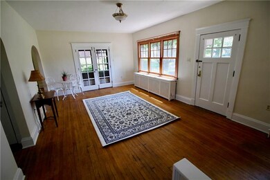 Light and bright living room with french doors to 