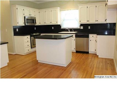 Kitchen features stainless steel appliances and fi