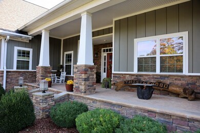 Large covered rocking-chair front porch. 