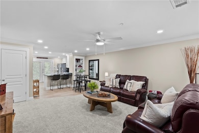 Living room featuring recessed lighting, and a cei