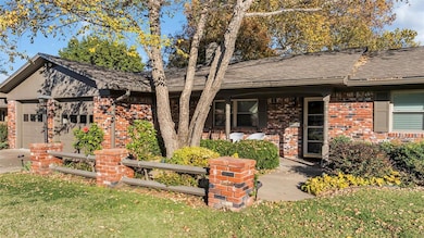 View of front of property featuring a garage and a