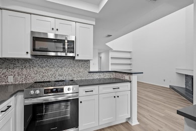Kitchen featuring appliances with stainless steel