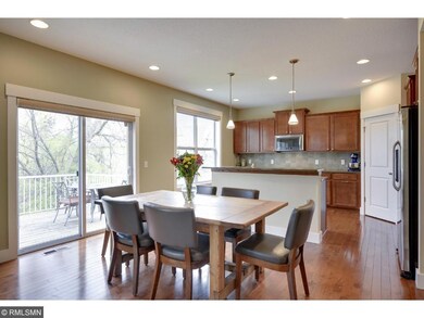 Gleaming wood  floors throughout foyer, dining roo