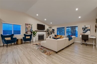 Living area with lofted ceiling, recessed lighting