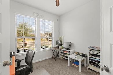 Charming French doors lead into a dedicated home o