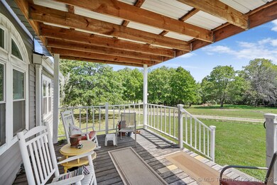 A covered front porch welcomes you on the south side.