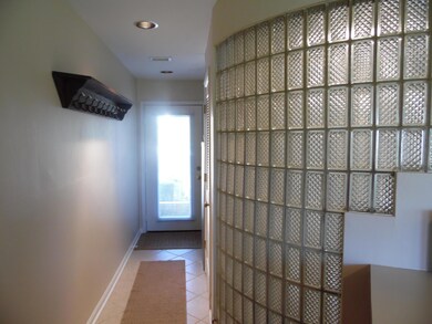 Glass block shower wall & foyer