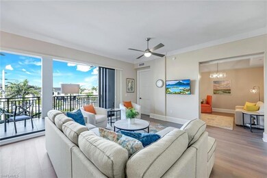 Living room featuring visible vents, ceiling fan, 