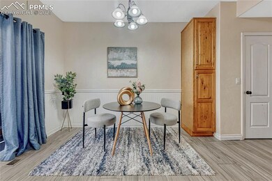 Dining area featuring light wood-type flooring, a 