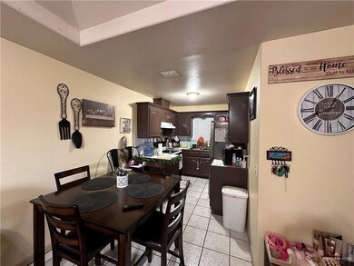 Dining space featuring light tile patterned flooring