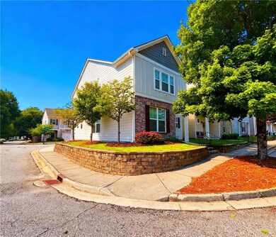 View of front facade with brick siding and board and batten siding